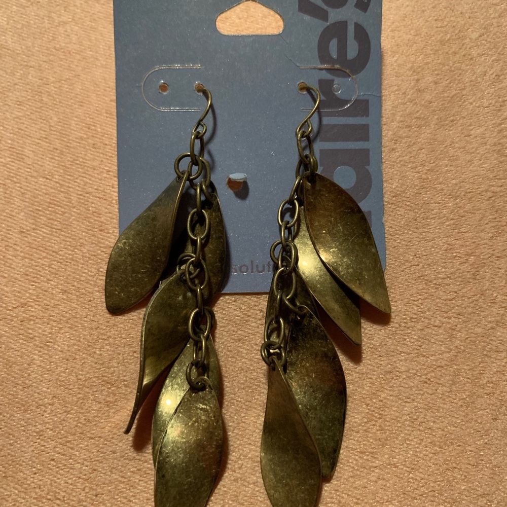 Betsey Johnson silver leaf earrings, Clair’s ear